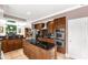 An open kitchen features stainless steel appliances, an island and wooden cabinets at 1853 Beach Ln, Heath Springs, SC 29058