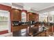A kitchen with dark granite counter tops, wooden cabinets, and a large window at 1853 Beach Ln, Heath Springs, SC 29058