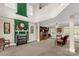Well-lit living room with a fireplace, classic decor, and a cozy atmosphere at 1853 Beach Ln, Heath Springs, SC 29058