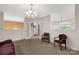 Spacious living room featuring neutral walls and carpeting and chandelier lighting at 1853 Beach Ln, Heath Springs, SC 29058