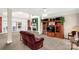Comfortable living room featuring a fireplace, large windows, and an inviting layout at 1853 Beach Ln, Heath Springs, SC 29058
