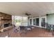 Inviting covered patio with stone fireplace and dining area, perfect for outdoor entertaining at 1853 Beach Ln, Heath Springs, SC 29058