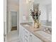 Modern bathroom featuring a double sink vanity, spacious layout, and natural light from a window at 1904 Lela Ave, Charlotte, NC 28208