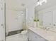 Modern bathroom with a walk-in shower, gray vanity, and neutral color scheme at 1904 Lela Ave, Charlotte, NC 28208