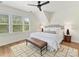 Bright bedroom with large windows, ceiling fan, and neutral tones offer a serene retreat at 1904 Lela Ave, Charlotte, NC 28208