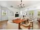Spacious dining room featuring an open layout into the living room and hardwood style floors at 1904 Lela Ave, Charlotte, NC 28208