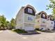 View of the modern townhome featuring attached garages and fresh landscaping at 1904 Lela Ave, Charlotte, NC 28208