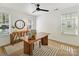 Bright home office featuring natural light, wood desk, striped rug and modern decor at 1904 Lela Ave, Charlotte, NC 28208
