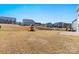 Grassy backyard featuring play-set, swing-set, and a patio at 2031 Killian Creek Dr, Denver, NC 28037