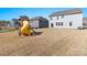 Large backyard featuring a playhouse with a slide, offering ample space for recreation and relaxation at 2031 Killian Creek Dr, Denver, NC 28037