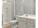 Bright bathroom features a white vanity, tile flooring, and a glass-enclosed shower at 2031 Killian Creek Dr, Denver, NC 28037