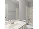 Bathroom with sleek vanity, large mirror, and tub-shower, offering a modern and functional space at 2031 Killian Creek Dr, Denver, NC 28037
