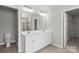 Well-lit bathroom features double vanity, large mirror, and tile flooring at 2031 Killian Creek Dr, Denver, NC 28037