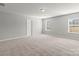 Spacious, carpeted bedroom with large windows and overhead lighting at 2031 Killian Creek Dr, Denver, NC 28037