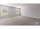 Spacious bedroom with plush carpeting and natural light from two windows at 2031 Killian Creek Dr, Denver, NC 28037
