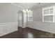Elegant dining room featuring wainscoting, stylish light fixture, and natural light at 2031 Killian Creek Dr, Denver, NC 28037