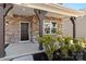 Inviting front porch with stone accents and wooden columns, creating a warm and welcoming entrance to the home at 2031 Killian Creek Dr, Denver, NC 28037