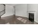 Open living room with fireplace and staircase with iron spindles at 2031 Killian Creek Dr, Denver, NC 28037