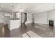 Spacious open-concept living room with hardwood floors, fireplace, and natural light at 2031 Killian Creek Dr, Denver, NC 28037