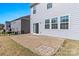 Cozy stone patio outside the home, ideal for outdoor seating and enjoying the serene backyard view at 2031 Killian Creek Dr, Denver, NC 28037