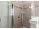 Tiled shower stall features glass door and tiled walls with decorative accents at 2031 Killian Creek Dr, Denver, NC 28037