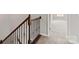 Carpeted staircase with dark wood railings and iron spindles at 2031 Killian Creek Dr, Denver, NC 28037