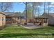 Backyard entertaining area featuring a patio, outdoor bar, and various seating areas at 235 Stafford Estates Dr, Salisbury, NC 28146