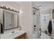 Clean bathroom featuring a shower-tub combo, vanity with lighting, and neutral color scheme at 235 Stafford Estates Dr, Salisbury, NC 28146