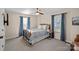 Well-lit bedroom with blue accents, comfortable furnishings, and ample natural light at 235 Stafford Estates Dr, Salisbury, NC 28146