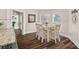 Sunlit breakfast nook with wooden table, decorative chandelier, and views of the outdoors at 235 Stafford Estates Dr, Salisbury, NC 28146