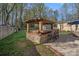 Backyard featuring a gazebo bar with seating and string lights perfect for entertaining guests at 235 Stafford Estates Dr, Salisbury, NC 28146