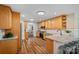 Spacious kitchen with wood cabinets, granite countertops, stainless steel appliances, and eat-in breakfast bar at 235 Stafford Estates Dr, Salisbury, NC 28146