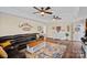 Spacious living room with a comfortable seating area, wood floors, and bright lighting at 235 Stafford Estates Dr, Salisbury, NC 28146