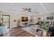 Inviting living room with tray ceiling, a fireplace, and ample natural light at 235 Stafford Estates Dr, Salisbury, NC 28146