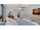 Relaxing main bedroom featuring a vanity, sliding barn door, and modern ceiling fan at 235 Stafford Estates Dr, Salisbury, NC 28146