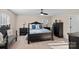 Serene main bedroom with dark wood furniture, a ceiling fan, and soft natural light at 235 Stafford Estates Dr, Salisbury, NC 28146