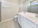 Bright bathroom with double vanity, modern fixtures, and a glass-enclosed shower at 2557 Grantham Place Dr, Fort Mill, SC 29715
