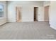 Spacious bedroom featuring neutral walls, carpet, and multiple closets, offering ample storage at 2557 Grantham Place Dr, Fort Mill, SC 29715