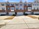 Charming townhouse exteriors with driveways and beautiful architectural details at 2557 Grantham Place Dr, Fort Mill, SC 29715