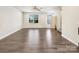 Spacious and well-lit living room with hardwood flooring, neutral walls and plenty of natural light at 2557 Grantham Place Dr, Fort Mill, SC 29715
