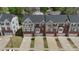 An aerial view showcasing a tidy row of townhomes in a well-maintained community at 2619 Grantham Place Dr, Fort Mill, SC 29715