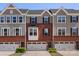 Charming townhome with brick facade, gray siding, and a one-car garage offers comfortable living at 2619 Grantham Place Dr, Fort Mill, SC 29715