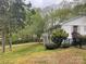 White brick house with backyard, wooden deck, and fenced yard at 2701 Rea Rd, Charlotte, NC 28226