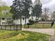 Large backyard with a white house featuring an upper deck and fenced perimeter at 2701 Rea Rd, Charlotte, NC 28226