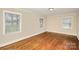 Bedroom featuring hardwood floors, natural light, and neutral paint at 2701 Rea Rd, Charlotte, NC 28226