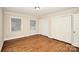 Bedroom featuring hardwood floors, natural light, and neutral paint at 2701 Rea Rd, Charlotte, NC 28226