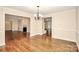 Spacious dining room leading to a living room with fireplace at 2701 Rea Rd, Charlotte, NC 28226