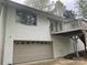 White brick house with a balcony over the two car garage at 2701 Rea Rd, Charlotte, NC 28226