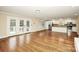 Open living room featuring hardwood floors and a view of the kitchen at 2701 Rea Rd, Charlotte, NC 28226