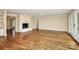Open living space with hardwood floors, fireplace and access to the porch at 2701 Rea Rd, Charlotte, NC 28226